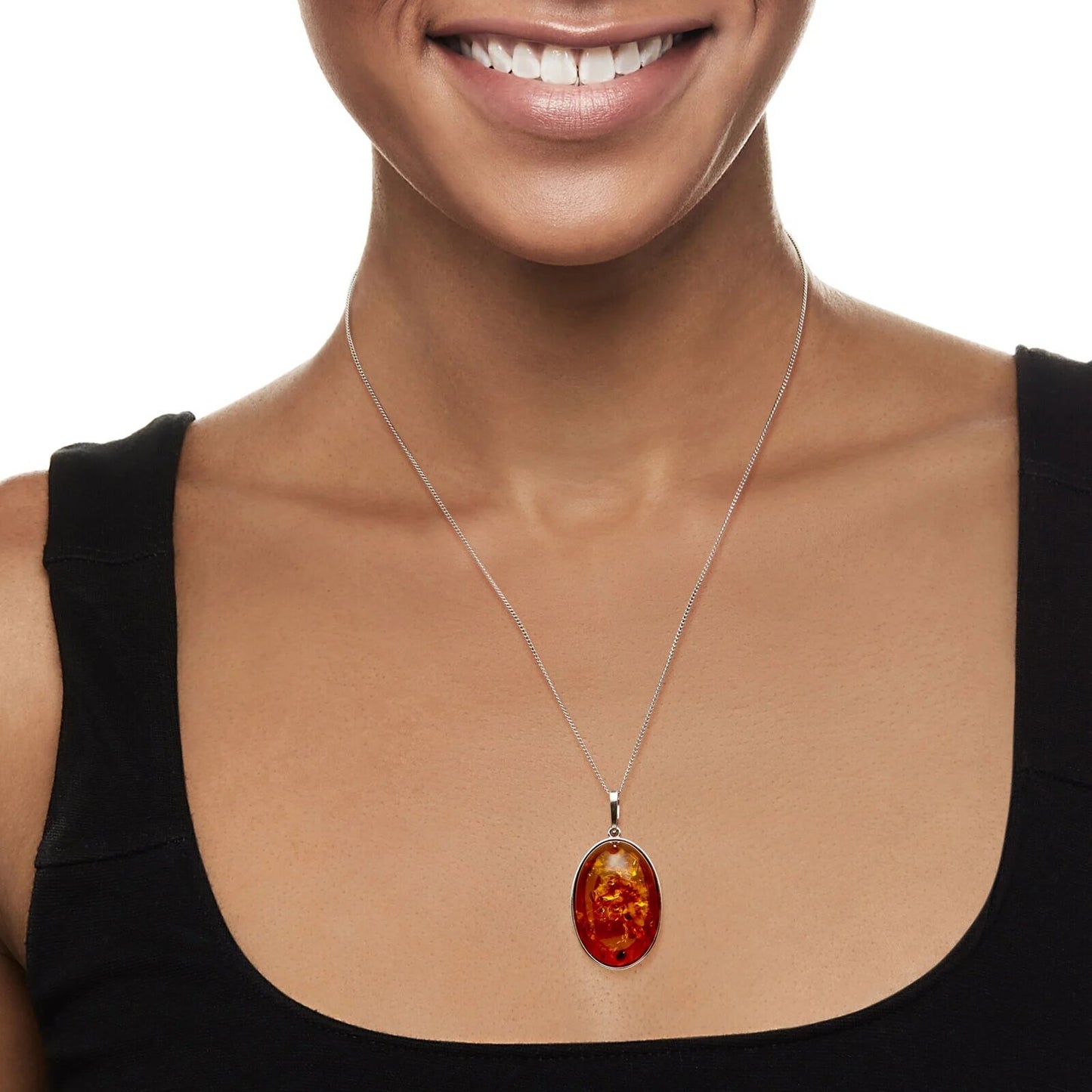 Elegant Oval Amber Pendant Necklace in Sterling Silver